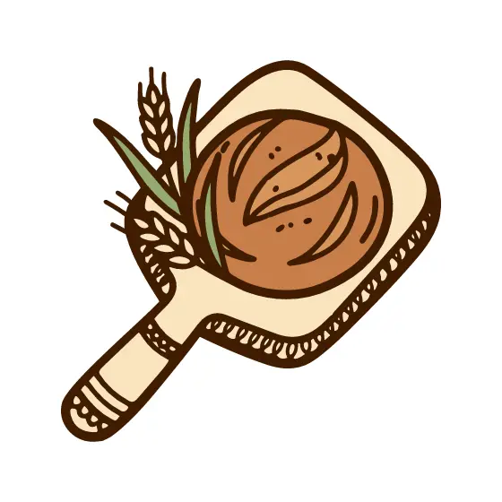 Bread Loaf on Peel with Wheat Sprigs