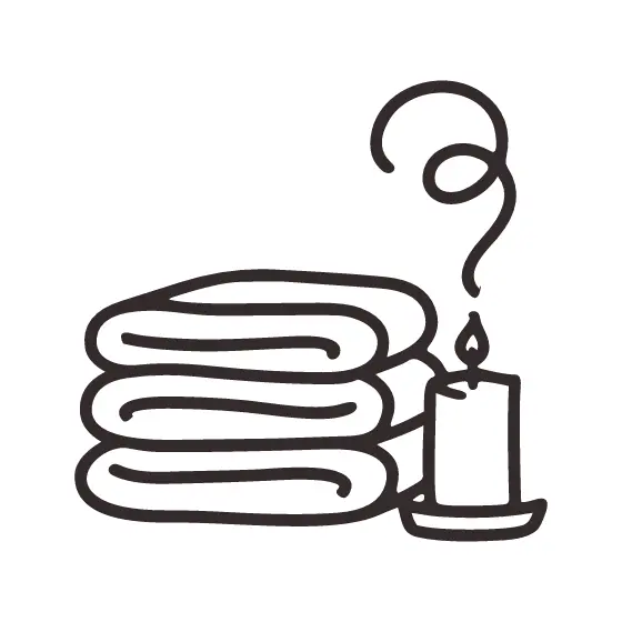 Folded Towels Beside Candle
